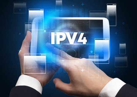 Close-up of a hand holding tablet with IPV4 abbreviation, modern technology concept