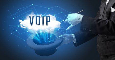 Magician is showing magic trick with VOIP abbreviation, modern tech concept