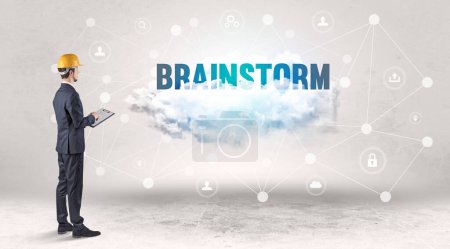 Photo for Engineer working on a social media concept with BRAINSTORM inscription - Royalty Free Image