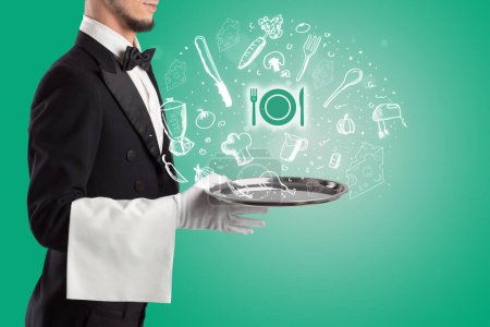 Téléchargez les photos : Serveur tenant plateau d'argent avec des icônes de vaisselle qui en sortent, concept de nourriture santé - en image libre de droit