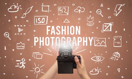 Photo for Hand taking picture with digital camera and FASHION PHOTOGRAPHY inscription, camera settings concept - Royalty Free Image