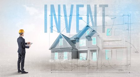 Foto de Joven ingeniero sosteniendo plano con inscripción INVENT, concepto de planificación de la casa - Imagen libre de derechos