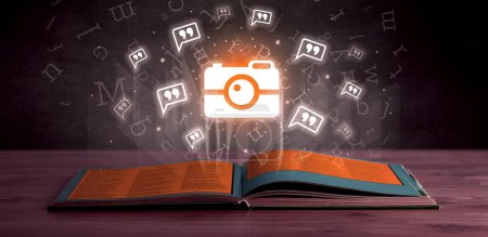 Photo for Open book with camera icons above, social networking concept - Royalty Free Image