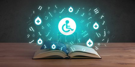 Téléchargez les photos : Livre médical ouvert avec icônes handicapées ci-dessus, concept de santé mondiale - en image libre de droit