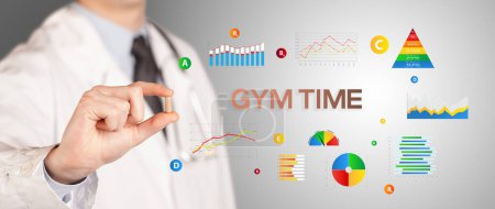 Nutritionist giving you a pill with GYM TIME inscription, healthy lifestyle concept