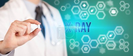 Photo for Close-up of a doctor giving you a pill with X-RAY inscription, medical concept - Royalty Free Image