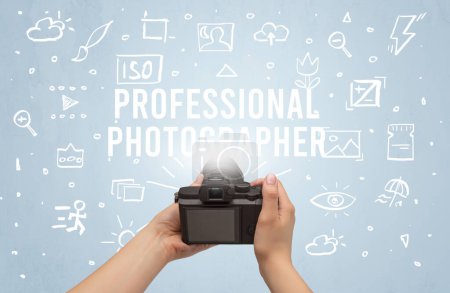 Photo for Hand taking picture with digital camera and PROFESSIONAL PHOTOGRAPHER inscription, camera settings concept - Royalty Free Image