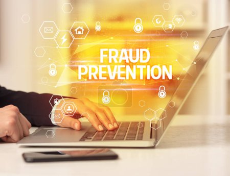 Photo for FRAUD PREVENTION inscription on laptop, internet security and data protection concept, blockchain and cybersecurity - Royalty Free Image