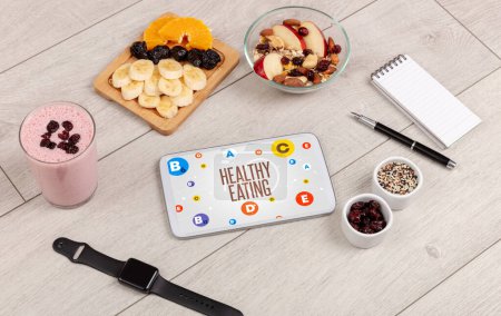 Composición sana de la tableta PC con la inscripción que come sano, concepto del concepto de la pérdida de peso