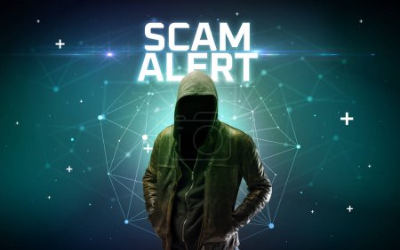 Photo for Mysterious hacker with SCAM ALERT inscription, online attack concept inscription, online security concept - Royalty Free Image