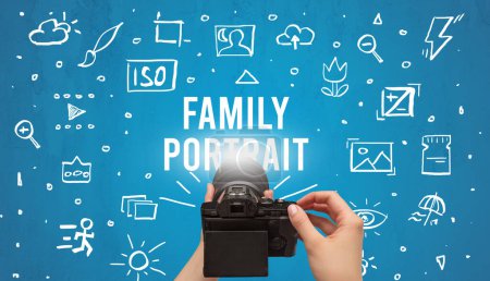 Photo for Hand taking picture with digital camera and FAMILY PORTRAIT inscription, camera settings concept - Royalty Free Image