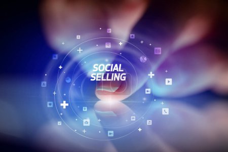 Photo for Finger touching tablet with social media icons and SOCIAL SELLING - Royalty Free Image