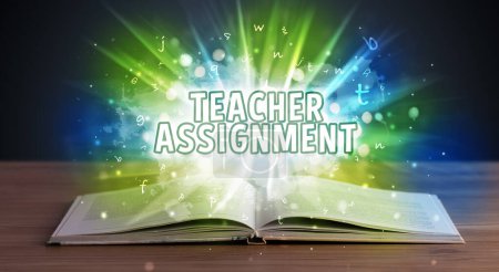 Photo for TEACHER ASSIGNMENT inscription coming out from an open book, educational concept - Royalty Free Image