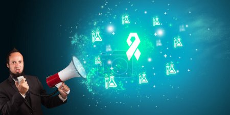 Photo for Young person shouting in megaphone and breast cancer icon, medical concept - Royalty Free Image