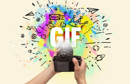 Foto de Primer plano de una cámara digital de mano con dibujo abstracto e inscripción GIF - Imagen libre de derechos