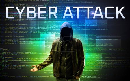 Photo for Faceless hacker with CYBER ATTACK inscription on a binary code background - Royalty Free Image
