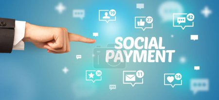 Photo for Close-Up of cropped hand pointing at SOCIAL PAYMENT inscription, social networking concept - Royalty Free Image