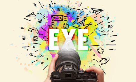 Photo for Close-up of a hand holding digital camera with abstract drawing and EXE inscription - Royalty Free Image
