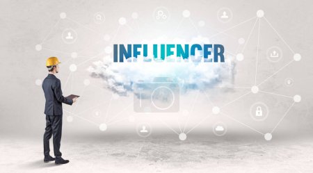 Photo for Engineer working on a social media concept with INFLUENCER inscription - Royalty Free Image
