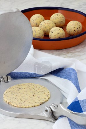 Photo for Mexican corn tortilla dough and tortillas, handmade with a tortilla press. - Royalty Free Image