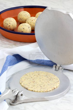 Photo for Mexican corn tortilla dough and tortillas, handmade with a tortilla press. - Royalty Free Image