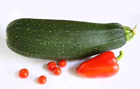 Photo for Vegetable marrow zucchini and sweet pepper isolated on white background. Photography of one fresh squash, top view. Theme of zucchini, organic food, nature. - Royalty Free Image