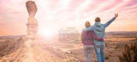 Photo for Traveler couple looking at Monegros desert,  Huesca province in Spain - Royalty Free Image
