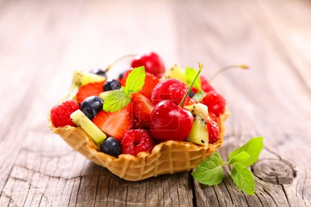 Photo for Fresh fruit salad in biscuit bowl - Royalty Free Image