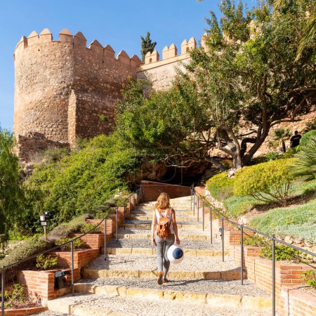 Téléchargez les photos : Woman tourist visiting Alcazaba of Almeria,  Spain - en image libre de droit