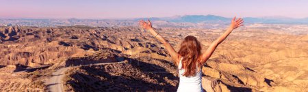 Photo for Happy woman traveling in Gorafe desert- badlands near Guadix,  Spain - Royalty Free Image