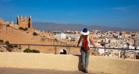 Foto de Woman looking at panoramic Almeria city landscape- Spain - Imagen libre de derechos