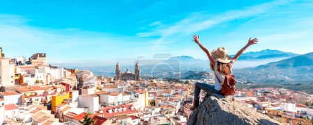 Téléchargez les photos : Woman tourist at Jaen, looking at panoramic view of the cathedral- Spain - en image libre de droit