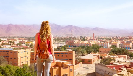 Woman tourist looking at panoramic view of Tata in Morocco