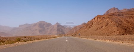 Photo for Straight road through the desert in Morocco - Royalty Free Image