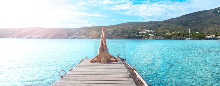 Photo for Legs of a woman on woman pier- relax,  vacation,  wellness concept - Royalty Free Image