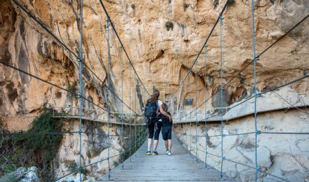 Photo for Mother and son walking on rope bridge - Royalty Free Image