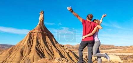 Photo for Happy couple at Bardenas desert in Spain - Royalty Free Image