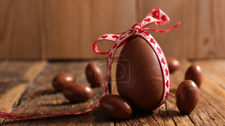 Photo for Chocolate easter egg with bow - Royalty Free Image