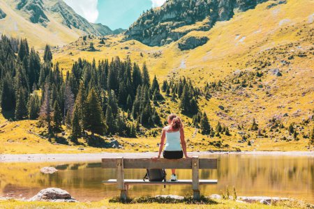 Photo for Woman traveling in Switzerland, lake, mountain and forest - Royalty Free Image