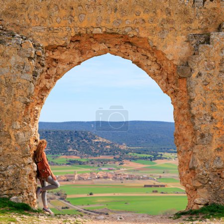 Photo for Tourism in Spain,  Castile and Leon- Woman tourist visiting Gormaz castle, Soria province - Royalty Free Image