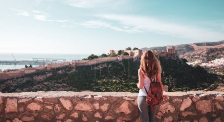 Téléchargez les photos : Woman tourist looking at Alcazaba of Almeria- Andalusia in Spain - en image libre de droit