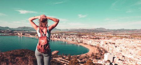 Photo for Woman tourist looking at panoramic view of Aguilas, Murcia province in Spain - Royalty Free Image