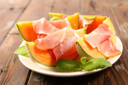 Photo for Melon slice with prosciutto ham - Royalty Free Image