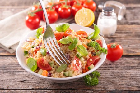 Photo for Tabbouleh, mixed vegetable salad with tomato, cucmber and basil - Royalty Free Image