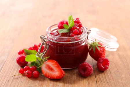 Photo for Berries fruits jam in jar and fresh fruit - Royalty Free Image
