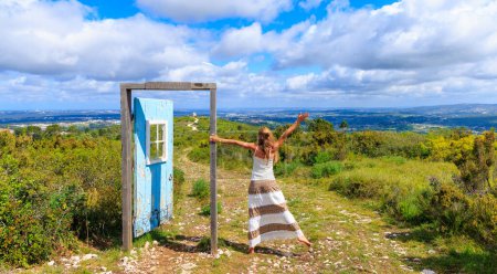Photo for Woman and open door in the nature- freedom,  choice,  hope concept - Royalty Free Image