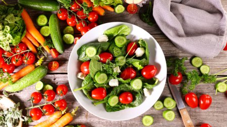 Photo for Mixed vegetable salad with spinach,  tomato and cucumber- healthy eating vegetarian food - Royalty Free Image