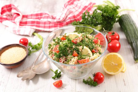 Photo for Tabbouleh salad on wood background - Royalty Free Image