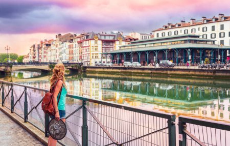 Photo for Traveler woman in France,  Bayonne city at sunset- Basque country,  Nouvelle aquitaine - Royalty Free Image