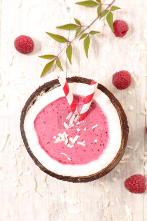 Photo for Berry fruit smoothie in coconut bowl- summer holiday,  fresh drink - Royalty Free Image